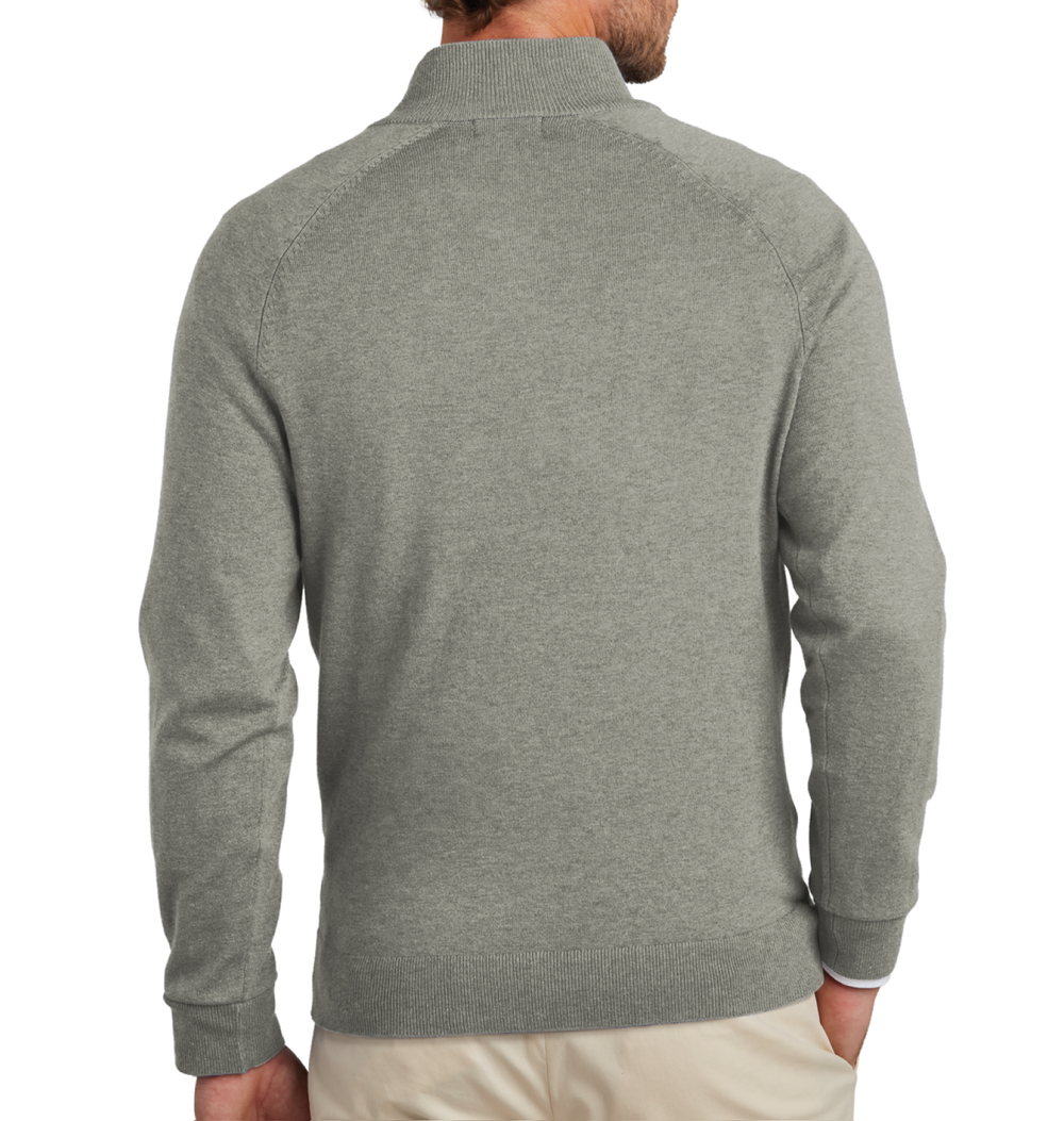 Back view of a male model wearing a grey Brooks Brothers sweater quarter zip.