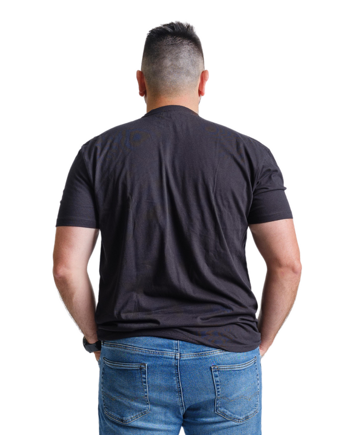 Back view of a Nudge Printing male model wearing a black t-shirt