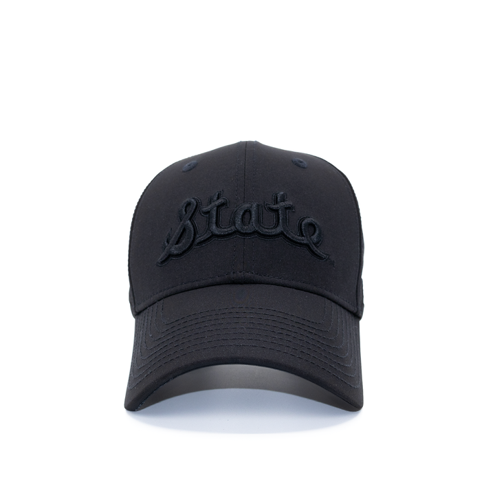 Front view of Michigan State all black State Script hat from Nudge Printing