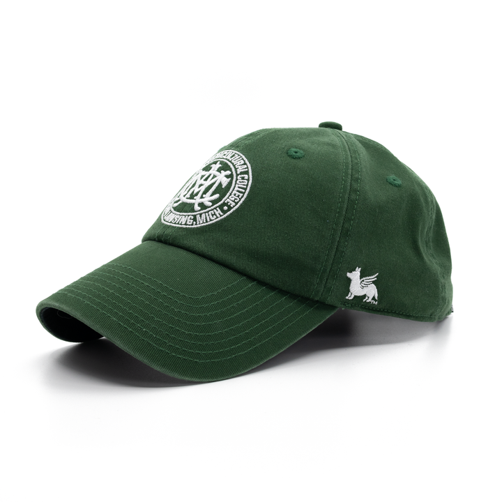 Angled view of the Michigan State University MAC (Michigan Agricultural College) dad hat in forest green from Nudge Printing