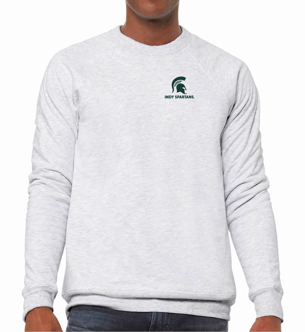 Man wearing an ash white Michigan State sweatshirt with a green Indy Spartans logo embroidered on the left chest.