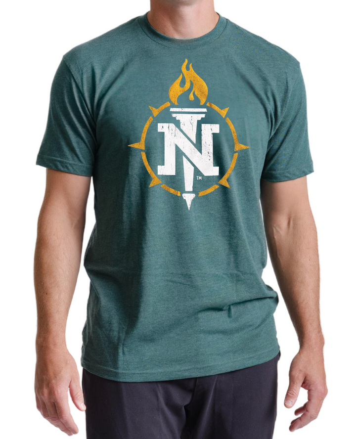 Male model wearing a forest green Northern Michigan t-shirt with the N torch logo printed in white and gold ink on the chest