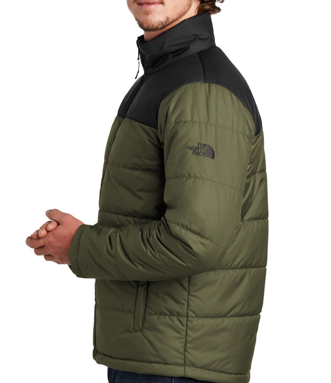 Side view of a Michigan State University Green and Black North Face Coat