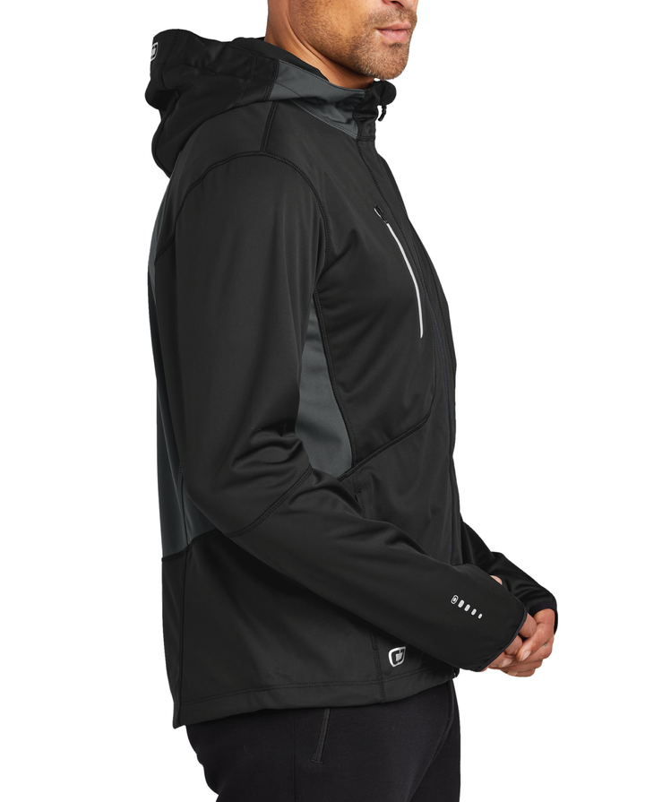 Side view of an OGIO performance Soft Shell Jacket worn by a male model