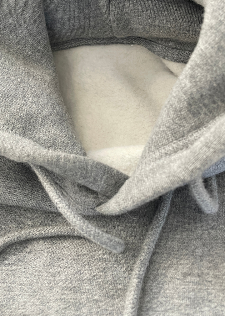 Close up picture of the soft interior of the varsity hoodie sweatshirt from Nudge Printing