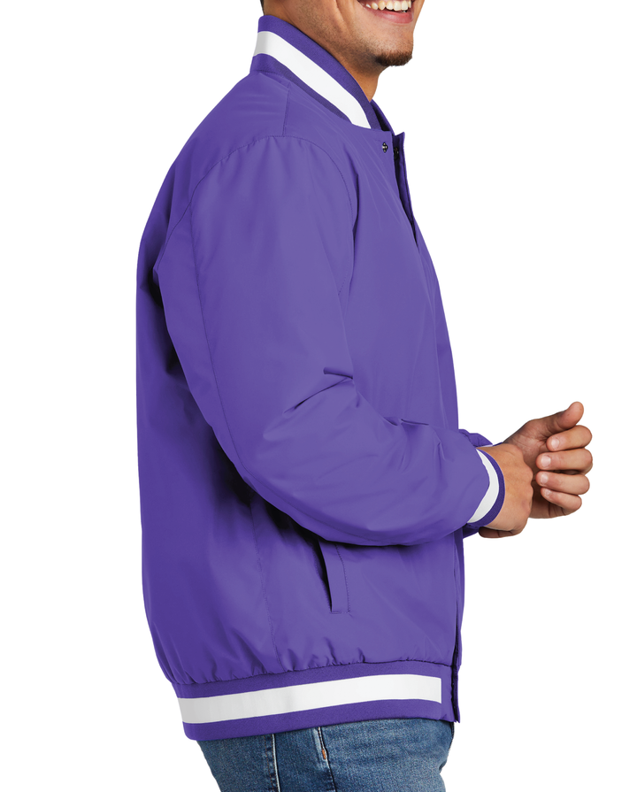 Side view of a purple varsity jacket being worn by an adult male